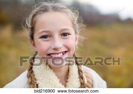 Stock Image - Close up of smiling girl. Fotosearch