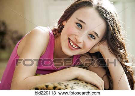 Stock Image - Close up of smiling girl. Fotosearch