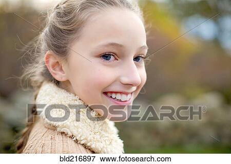 Stock Photo - Close up of smiling girl. Fotosearch