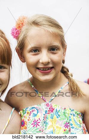 Stock Image - Close up of smiling girls. Fotosearch