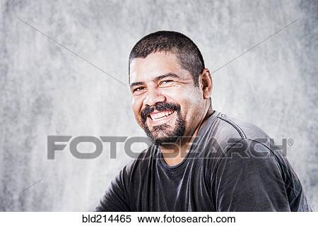 Stock Photography - Close up of smiling Hispanic man. Fotosearch