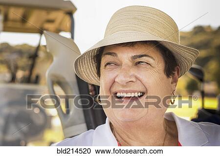 Close up of smiling older woman wearing hat View Large Photo Image Stock Image - Close up of smiling older woman wearing hat. Fotosearch
