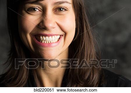Stock Image - Close up of smiling woman. Fotosearch