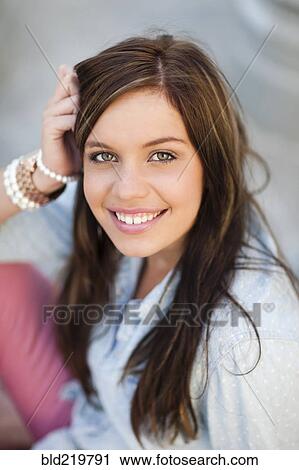 Close up of smiling woman with long hair View Large Photo Image Stock Image - Close up of smiling woman with long hair. Fotosearch