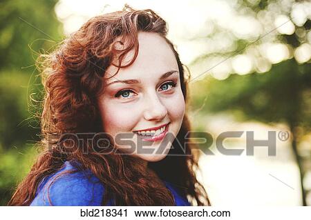 Close up of smiling woman with red hair View Large Photo Image Stock Image - Close up of smiling woman with red hair. Fotosearch