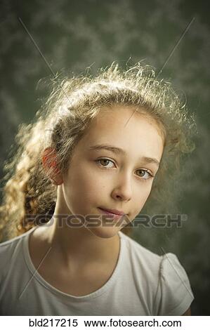 Stock Photography - Close up of somber Caucasian girl. Fotosearch