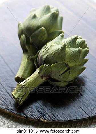 Stock Photography - Close up of two artichokes. Fotosearch