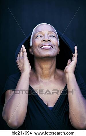 Close up of woman covering her head with shawl View Large Photo Image Picture - Close up of woman covering her head with shawl. Fotosearch