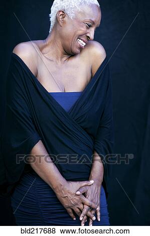Close up of woman laughing in shawl View Large Photo Image Stock Photo - Close up of woman laughing in shawl. Fotosearch