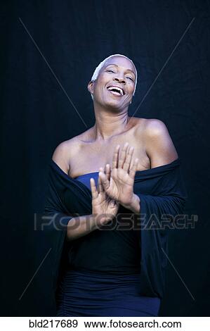 Close up of woman laughing in shawl View Large Photo Image Stock Photo - Close up of woman laughing in shawl. Fotosearch