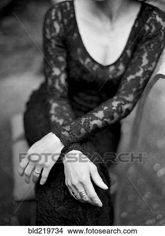 Picture - Close up of woman sitting in backyard. Fotosearch