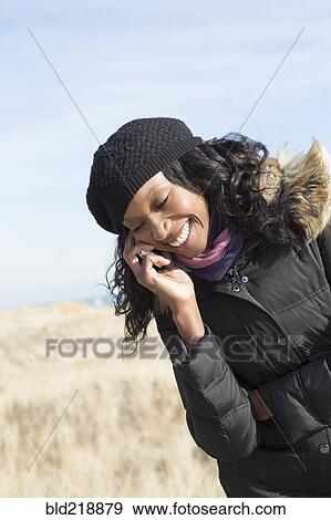 Close up of woman talking on cell phone outdoors View Large Photo Image Stock Photo - Close up of woman talking on cell phone outdoors. Fotosearch