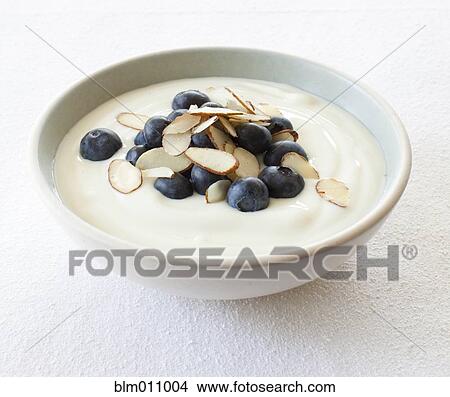 Close up of yogurt, fruit and nuts in bowl View Large Photo Image Picture - Close up of yogurt, fruit and nuts in bowl. Fotosearch