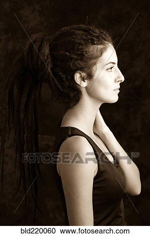 Close up profile of serious woman with dreadlocks View Large Photo Image Stock Image - Close up profile of serious woman with dreadlocks. Fotosearch