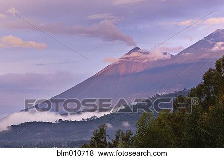 Stock Photo - Clouds and mountain in remote area. Fotosearch