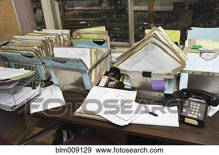 Cluttered factory office View Large Photo Image Stock Photo - Cluttered factory office. Fotosearch