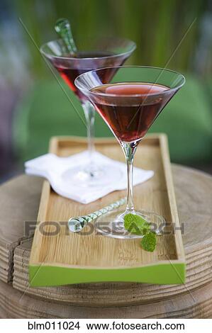 Cocktails in martini glasses on tray View Large Photo Image Picture - Cocktails in martini glasses on tray. Fotosearch