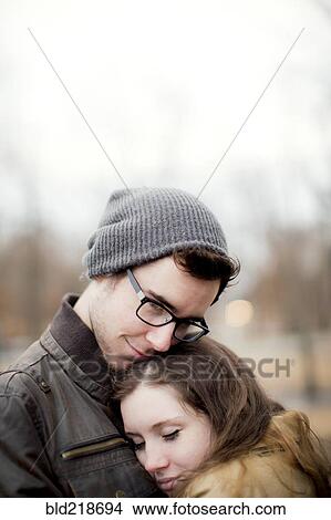Couple hugging outdoors View Large Photo Image Picture - Couple hugging outdoors. Fotosearch