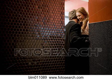 Stock Photo - Couple kissing in bathroom. Fotosearch