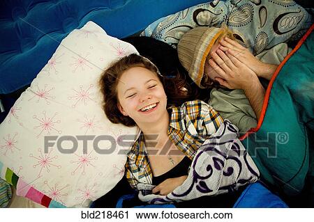 Couple laughing in camping tent View Large Photo Image Stock Image - Couple laughing in camping tent. Fotosearch