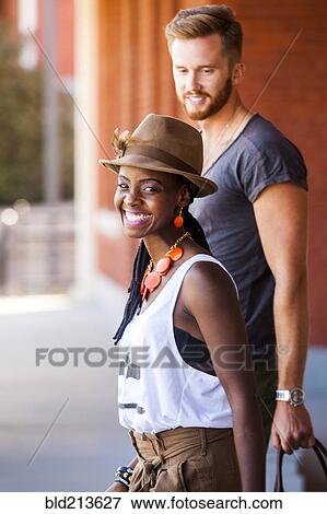 Stock Photo - Couple walking together outdoors. Fotosearch