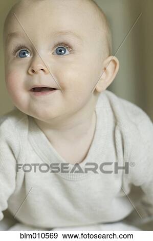 Stock Photo - Curious Caucasian baby. Fotosearch