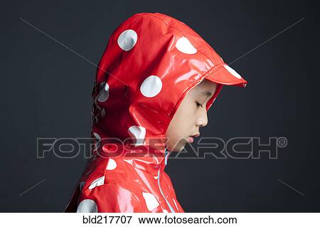 Disappointed Asian girl wearing hooded raincoat View Large Photo Image Stock Photo - Disappointed Asian girl wearing hooded raincoat. Fotosearch