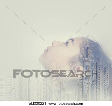 Stock Image - Double exposure of mixed race girl and cityscape. Fotosearch