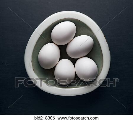 Stock Photography - Eggs in ceramic bowl. Fotosearch