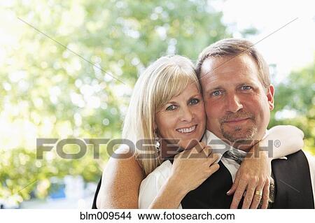 Picture - Elegant Caucasian couple hugging. Fotosearch