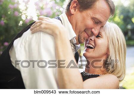 Elegant Caucasian couple hugging View Large Photo Image Stock Image - Elegant Caucasian couple hugging. Fotosearch