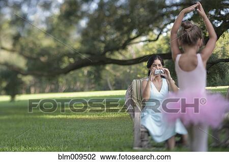 Elegant mother photographing ballerina daughter View Large Photo Image Stock Image - Elegant mother photographing ballerina daughter. Fotosearch