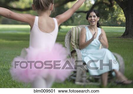 Elegant mother sitting in backyard with ballerina daughter View Large Photo Image Stock Image - Elegant mother sitting in backyard with ballerina daughter. Fotosearch