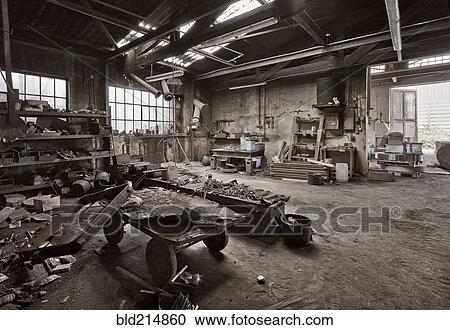 Stock Image - Empty dilapidated casting metalwork workshop. Fotosearch