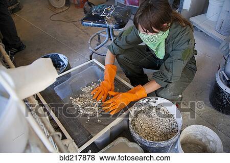 Stock Photo - Entrepreneur working in workshop. Fotosearch