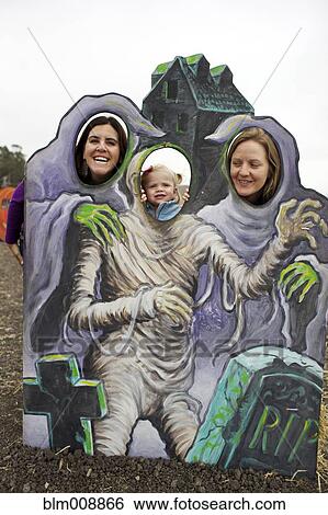 Family enjoying Halloween decoration View Large Photo Image Stock Photograph - Family enjoying Halloween decoration. Fotosearch