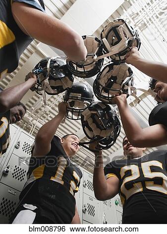 Football players celebrating in locker room View Large Photo Image Stock Photograph - Football players celebrating in locker room. Fotosearch