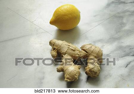 Stock Image - Fresh ginger root and lemon. Fotosearch