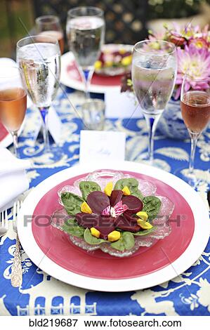 Stock Photo - Fresh salad on backyard table. Fotosearch