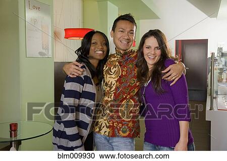 Friends hugging in cafe View Large Photo Image Stock Image - Friends hugging in cafe. Fotosearch