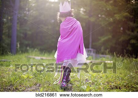 Girl playing princess in backyard View Large Photo Image Stock Image - Girl playing princess in backyard. Fotosearch