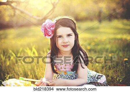 Girl playing with pinwheel in rural field View Large Photo Image Picture - Girl playing with pinwheel in rural field. Fotosearch