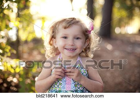 Girl smiling on forest path View Large Photo Image Stock Image - Girl smiling on forest path. Fotosearch