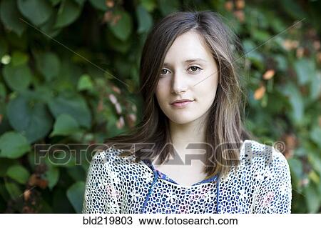 Girl standing near ivy plants View Large Photo Image Stock Image - Girl standing near ivy plants. Fotosearch