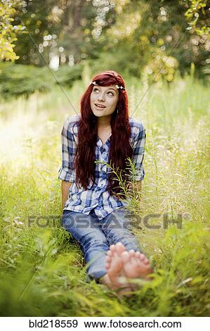 Girl wearing flower crown in rural field View Large Photo Image Stock Photo - Girl wearing flower crown in rural field. Fotosearch