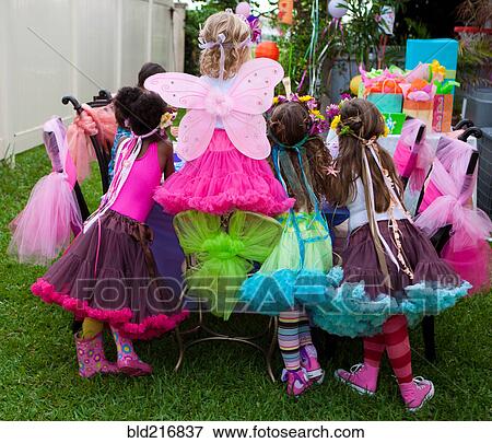 Girls playing dress-up at birthday party View Large Photo Image Stock Photo - Girls playing dress-up at birthday party. Fotosearch