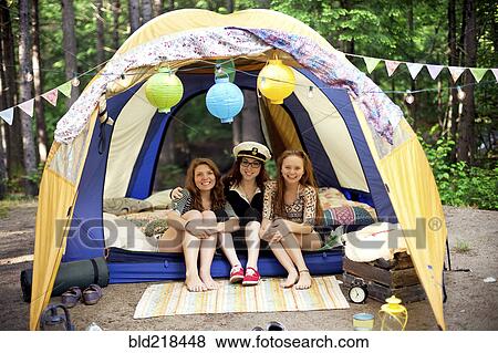 Girls relaxing in camping tent View Large Photo Image Stock Photo - Girls relaxing in camping tent. Fotosearch