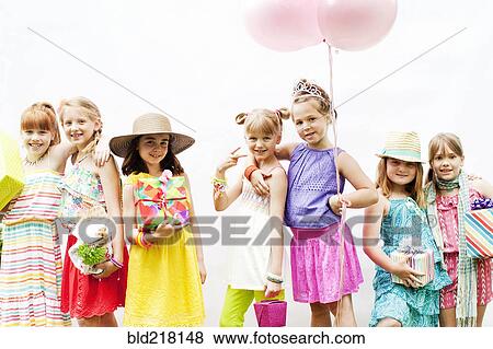Stock Photo - Girls smiling at party. Fotosearch