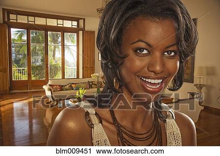 Glamorous Black woman in living room View Large Photo Image Stock Image - Glamorous Black woman in living room. Fotosearch