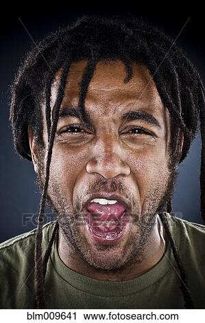 Grimacing Black man View Large Photo Image Stock Image - Grimacing Black man. Fotosearch